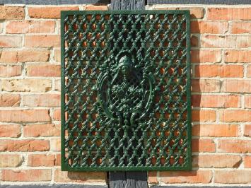 Gietijzeren hekwerk, rooster, wand, deur en raam