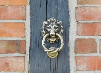 Deurklopper leeuw, antiek ijzer, zwart en messing kleur